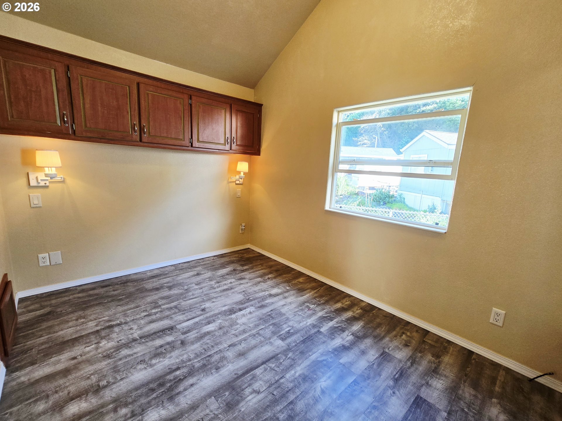 16219 Lower Harbor Road, Unit 18 Brookings, OR 97415 - Photo 25 of 38 a view of empty room with wooden floor