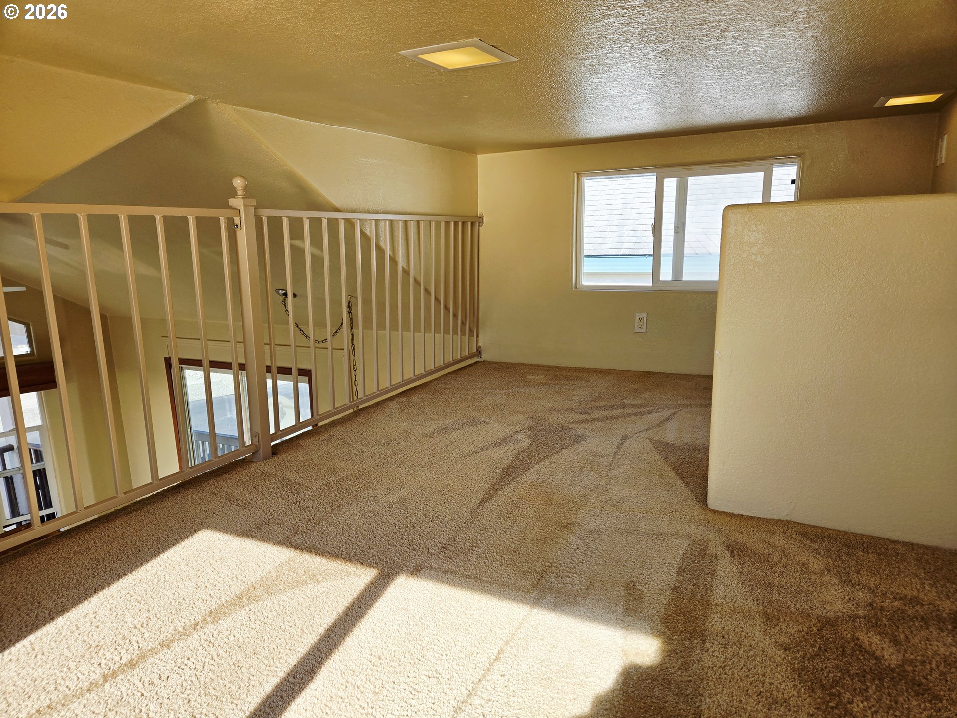16219 Lower Harbor Road, Unit 18 Brookings, OR 97415 - Photo 30 of 38 a view of a hallway with wooden floor