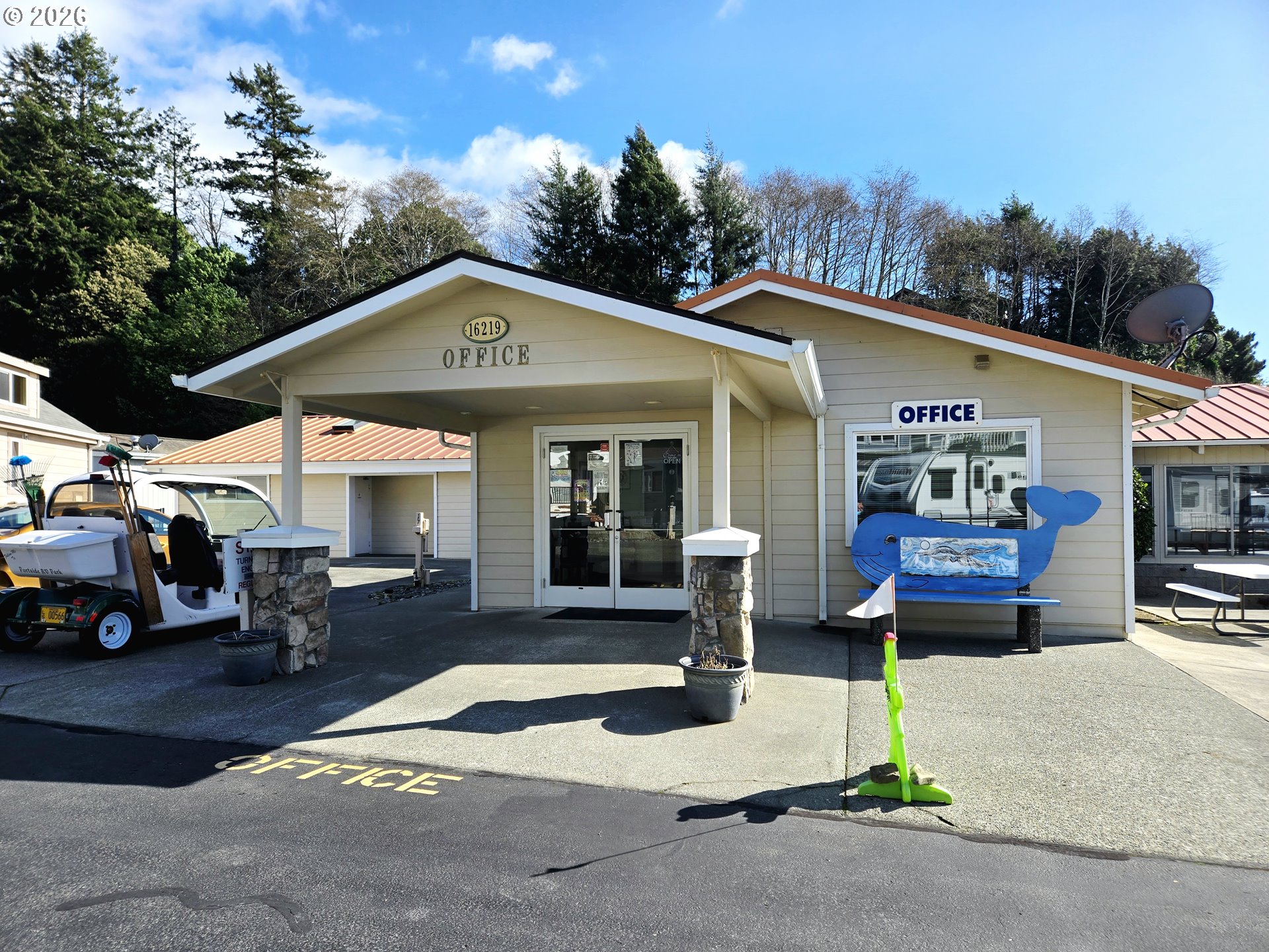 16219 Lower Harbor Road, Unit 18 Brookings, OR 97415 - Photo 35 of 38 a front view of a house with garden