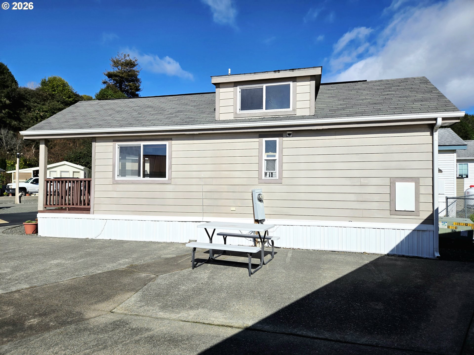 16219 Lower Harbor Road, Unit 18 Brookings, OR 97415 - Photo 4 of 38 a view of a back yard of the house
