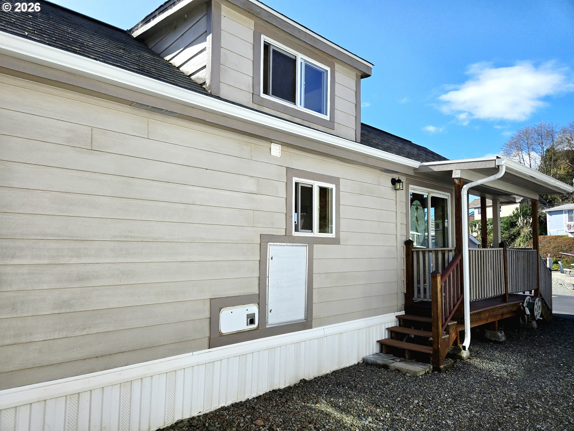 16219 Lower Harbor Road, Unit 18 Brookings, OR 97415 - Photo 8 of 38 a view of a house with a yard