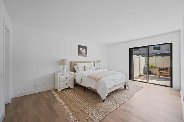 a bedroom with a large bed and a window