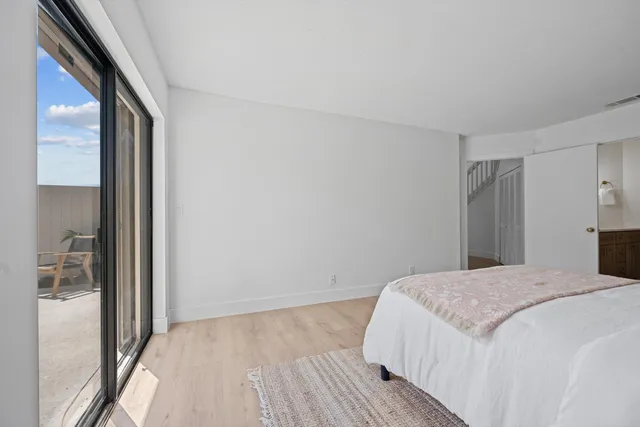 a spacious bathroom with a sink and a mirror
