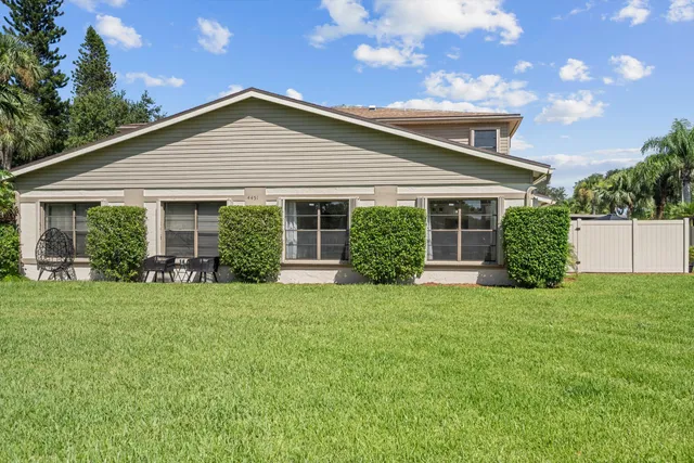 a view of yard with swimming pool and green space