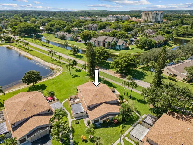 an aerial view of a house with a lake view