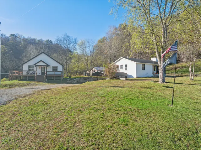 a view of a pathway with a wrought fence
