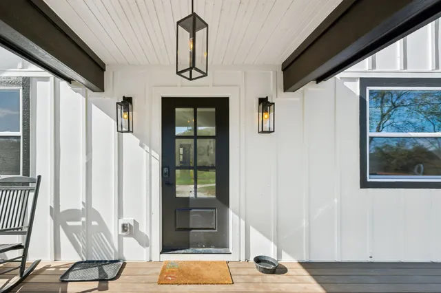 a front view of a house with wooden floor