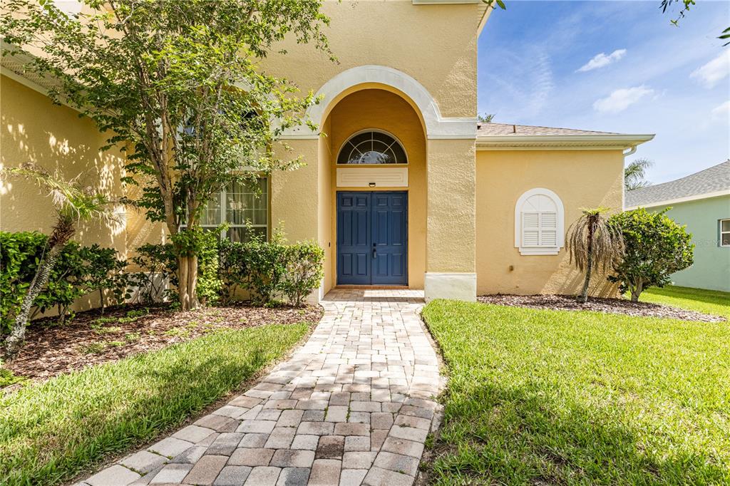 2718 Knightsbridge Road Clermont, FL 34711 - Photo 3 of 72 a house view with a garden space