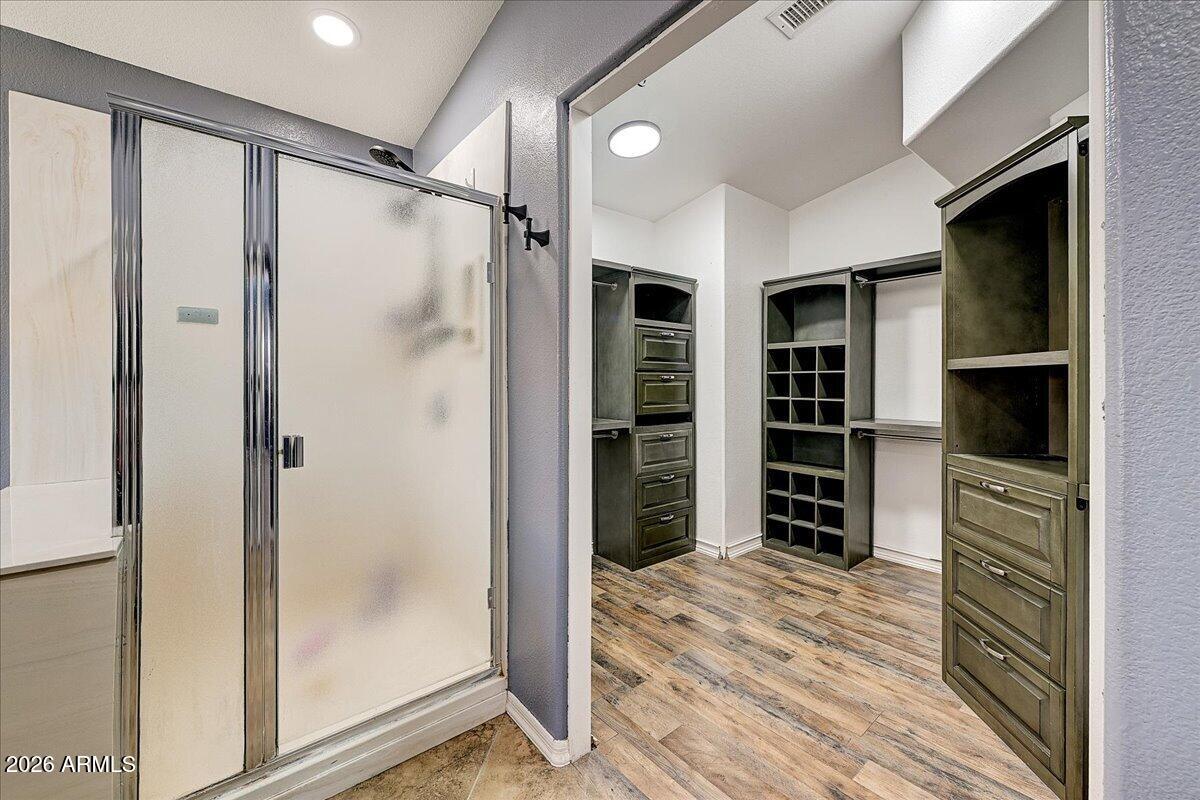 7624 North Citrus Road Waddell, AZ 85355 - Photo 26 of 57 a view of walk in closet with wooden floor