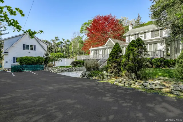 a front view of a house with a yard and a garage