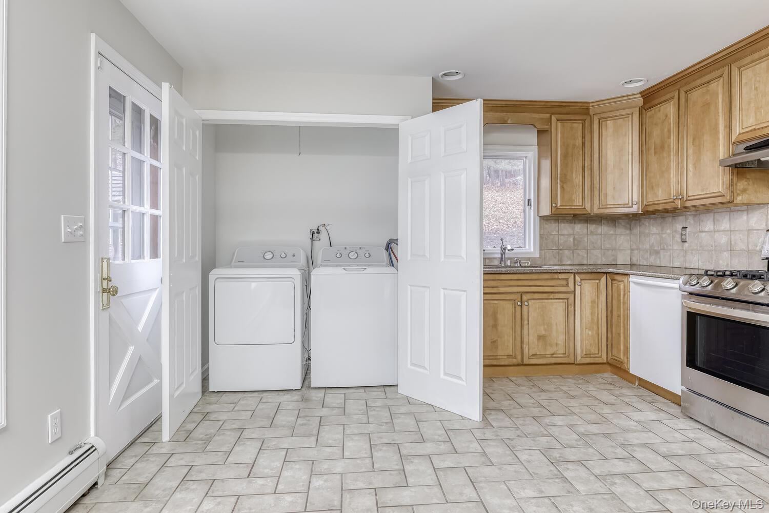 121 Thiells Road Stony Point, NY 10980 - Photo 12 of 34 a kitchen with a stove a sink and a refrigerator