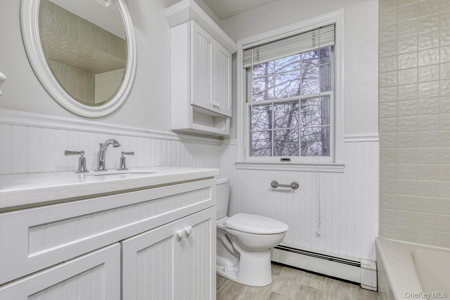121 Thiells Road Stony Point, NY 10980 - Photo 18 of 34 a bathroom with a toilet a sink and mirror