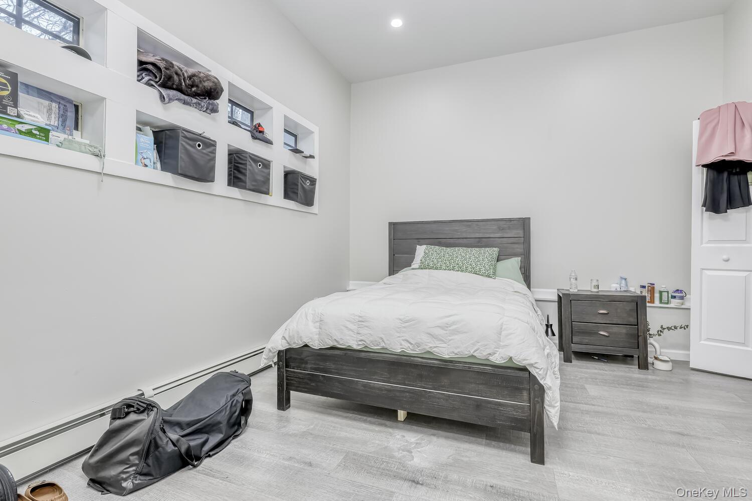 121 Thiells Road Stony Point, NY 10980 - Photo 28 of 34 a bedroom with a bed and a flat tv screen on the dresser