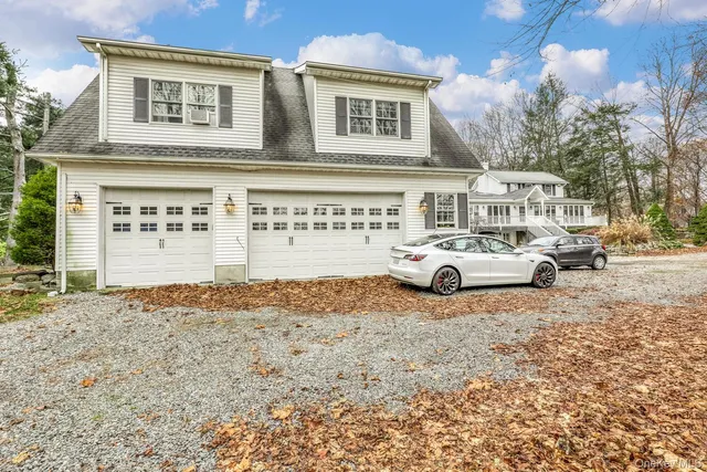 a view of a cars parking space in front of a building