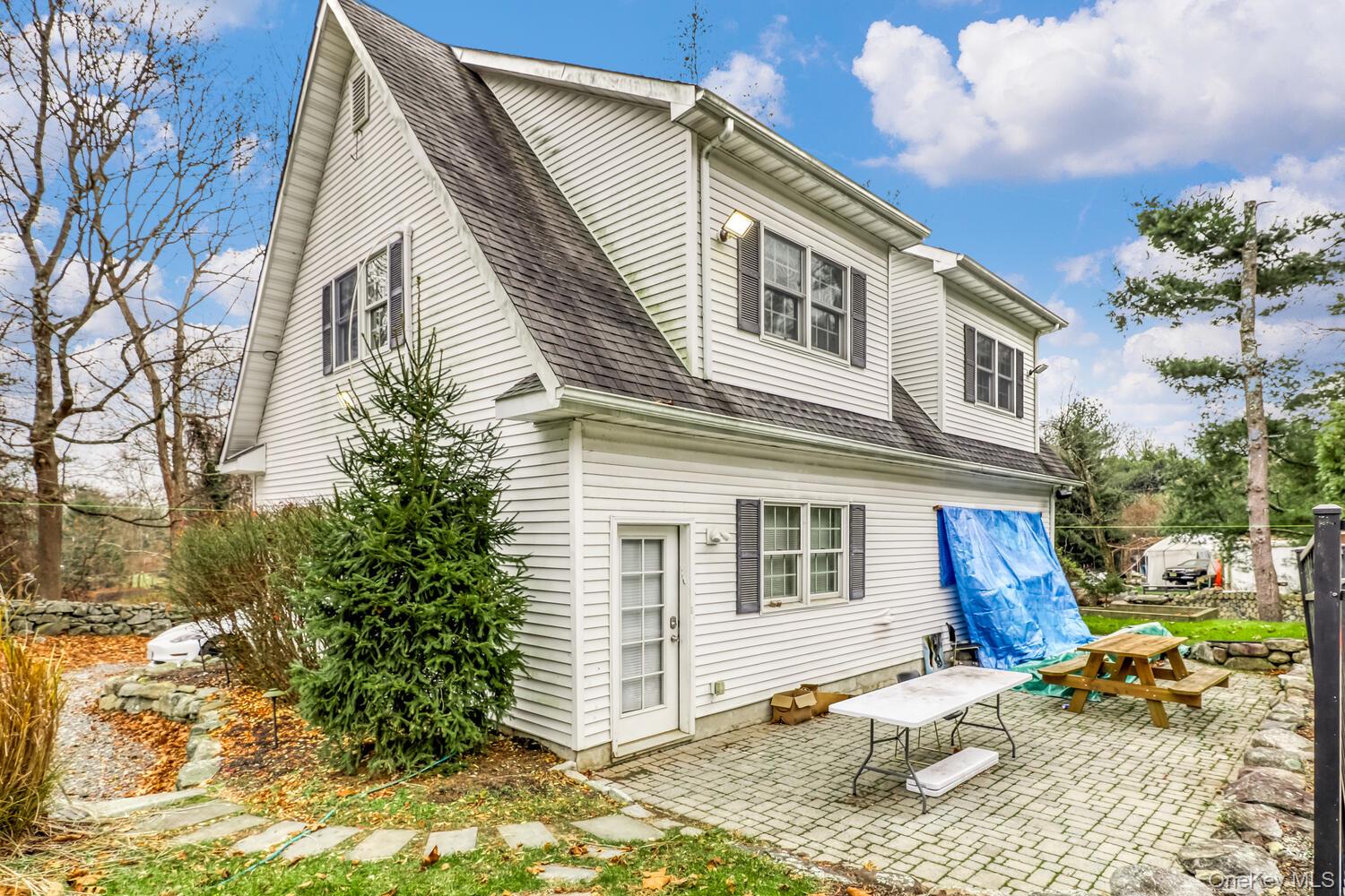 121 Thiells Road Stony Point, NY 10980 - Photo 5 of 34 a front view of a house with garden