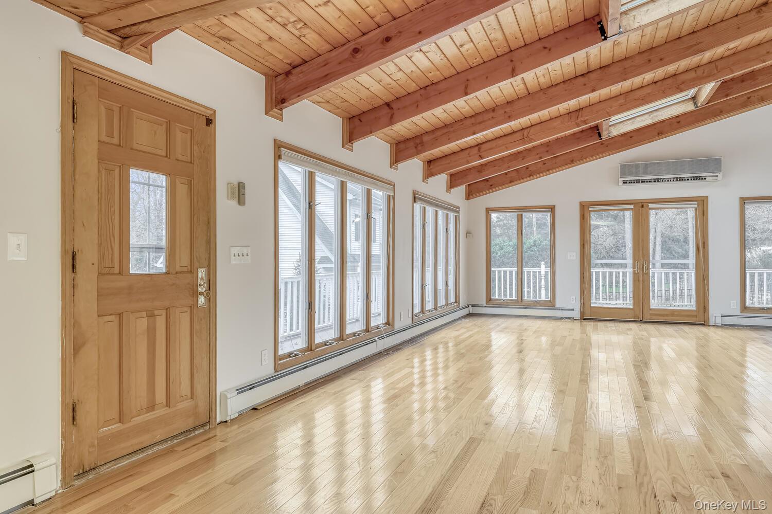 121 Thiells Road Stony Point, NY 10980 - Photo 8 of 34 a view of an empty room with wooden floor and a window