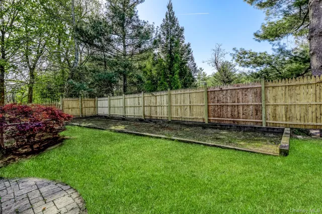 a view of a backyard with a swing