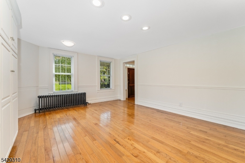 234 Cokesbury Califon Road Lebanon, NJ 08833 - Photo 14 of 46 an empty room with wooden floor and windows