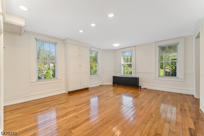 234 Cokesbury Califon Road Lebanon, NJ 08833 - Photo 17 of 46 an empty room with wooden floor and windows