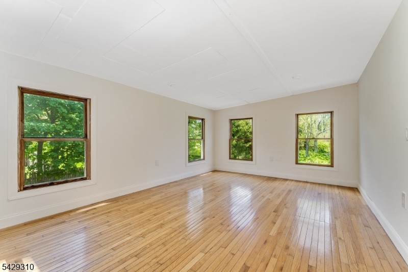 234 Cokesbury Califon Road Lebanon, NJ 08833 - Photo 19 of 46 a view of an empty room with wooden floor and a window