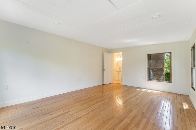 234 Cokesbury Califon Road Lebanon, NJ 08833 - Photo 20 of 46 a view of an empty room with wooden floor and a window