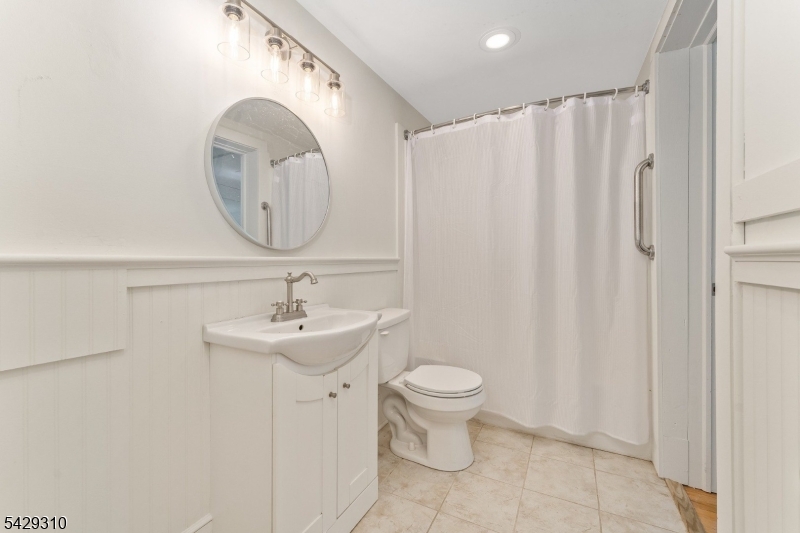 234 Cokesbury Califon Road Lebanon, NJ 08833 - Photo 34 of 46 a bathroom with a sink a toilet and a mirror
