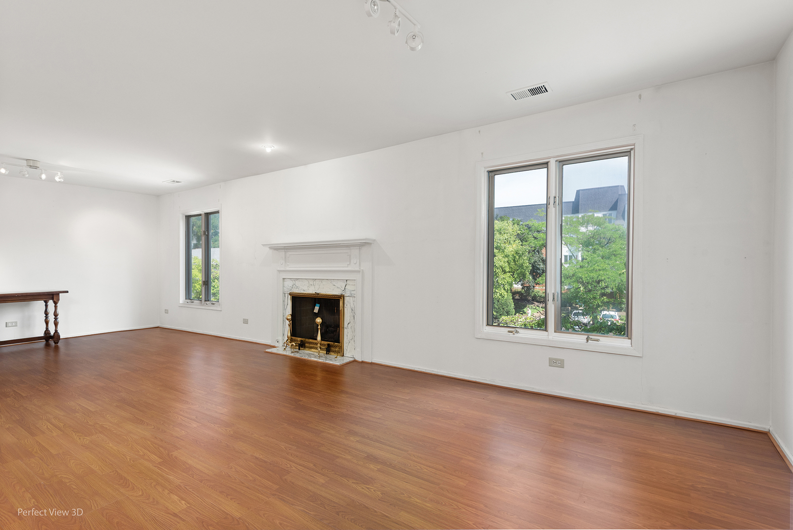 150 Lake Boulevard, Unit 125 Buffalo Grove, IL 60089 - Photo 12 of 30 an empty room with windows and a fireplace