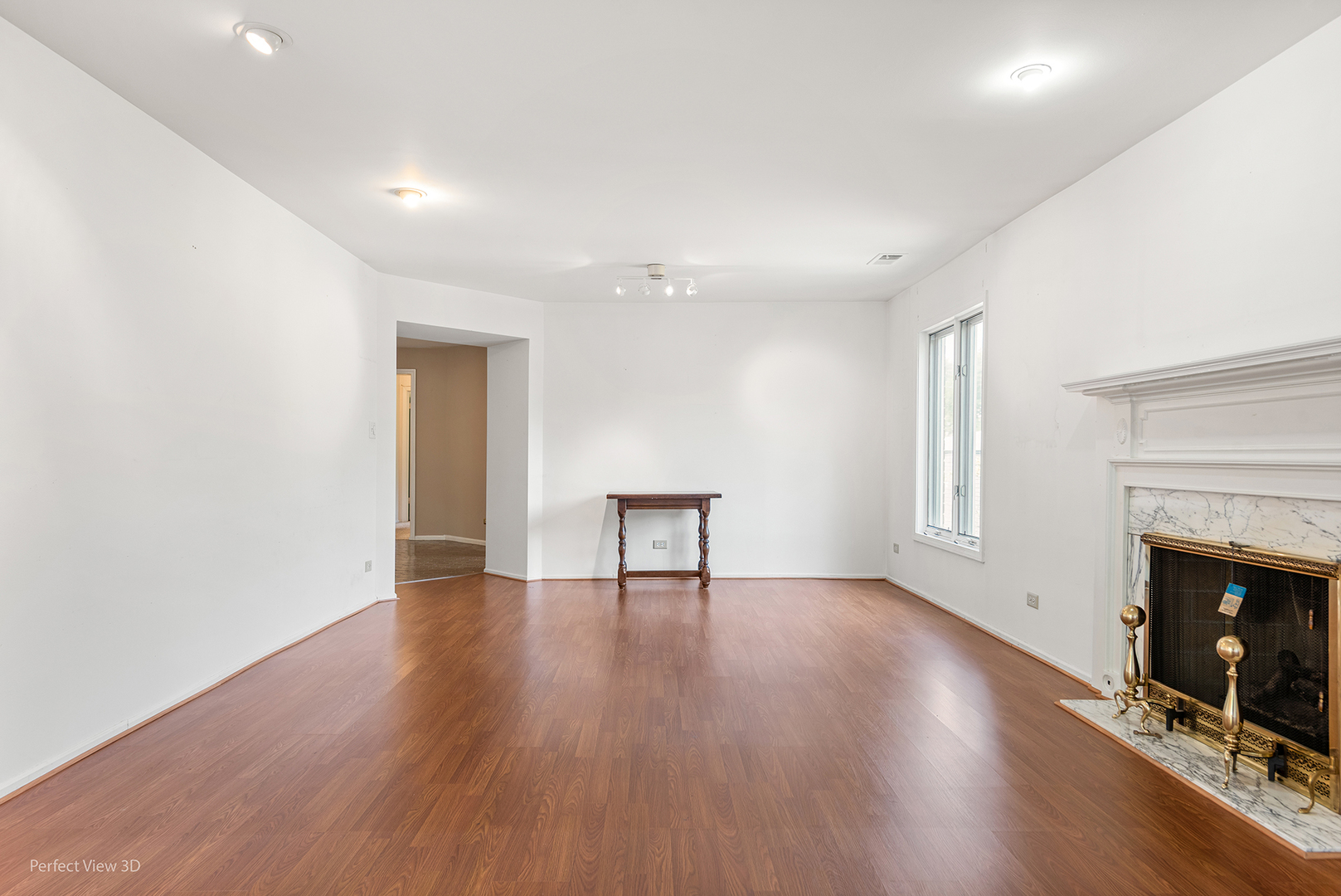 150 Lake Boulevard, Unit 125 Buffalo Grove, IL 60089 - Photo 13 of 30 a view of an empty room with wooden floor and a fireplace