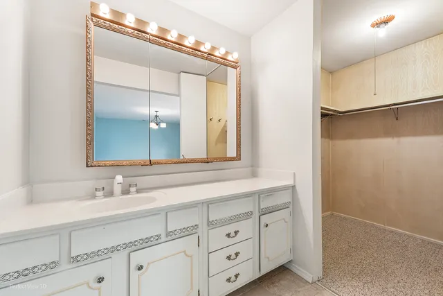 a bathroom with a double vanity sink and mirror