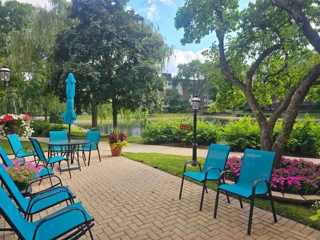 an outdoor living space with furniture and garden view