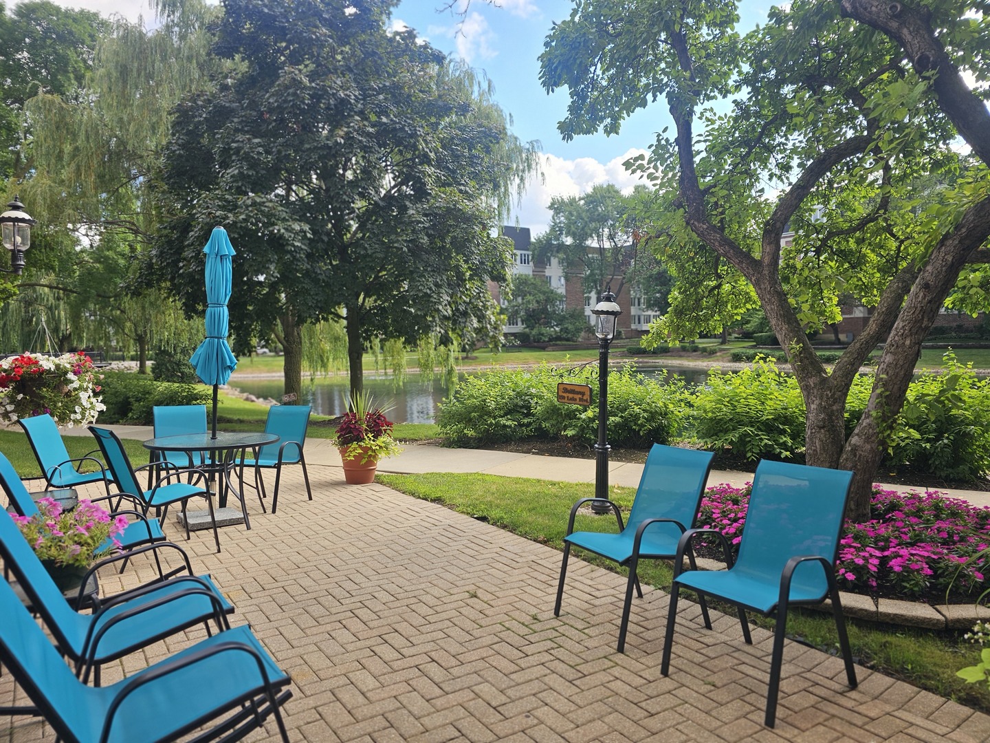 150 Lake Boulevard, Unit 125 Buffalo Grove, IL 60089 - Photo 25 of 30 an outdoor living space with furniture and garden view