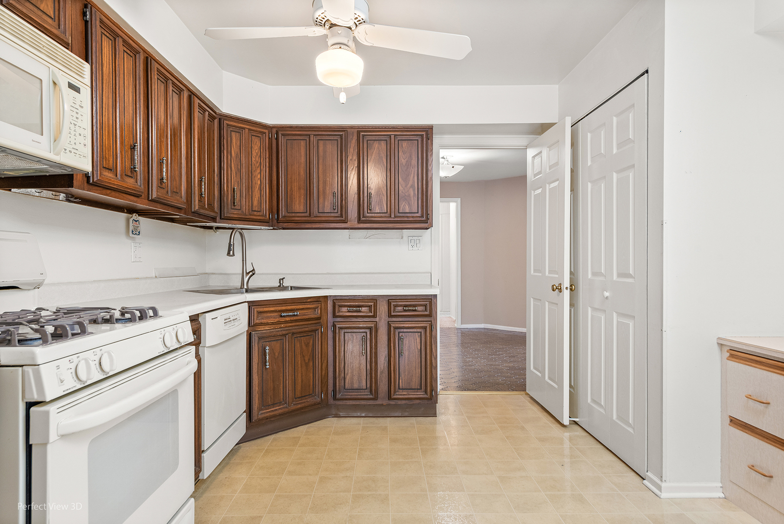 150 Lake Boulevard, Unit 125 Buffalo Grove, IL 60089 - Photo 6 of 30 a kitchen with stainless steel appliances granite countertop a stove a sink and a refrigerator with cabinets