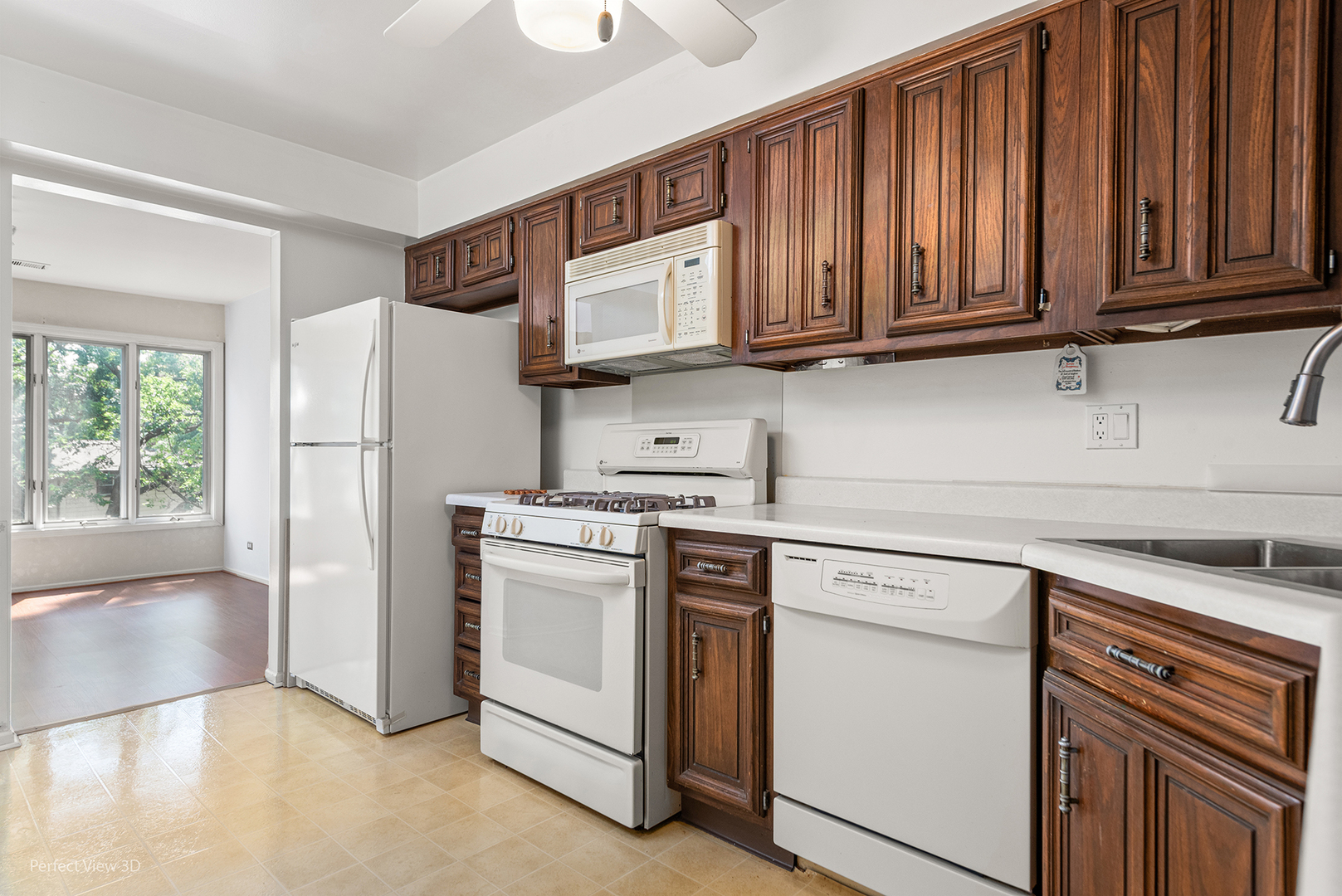 150 Lake Boulevard, Unit 125 Buffalo Grove, IL 60089 - Photo 7 of 30 a kitchen with stainless steel appliances granite countertop a refrigerator sink and cabinets