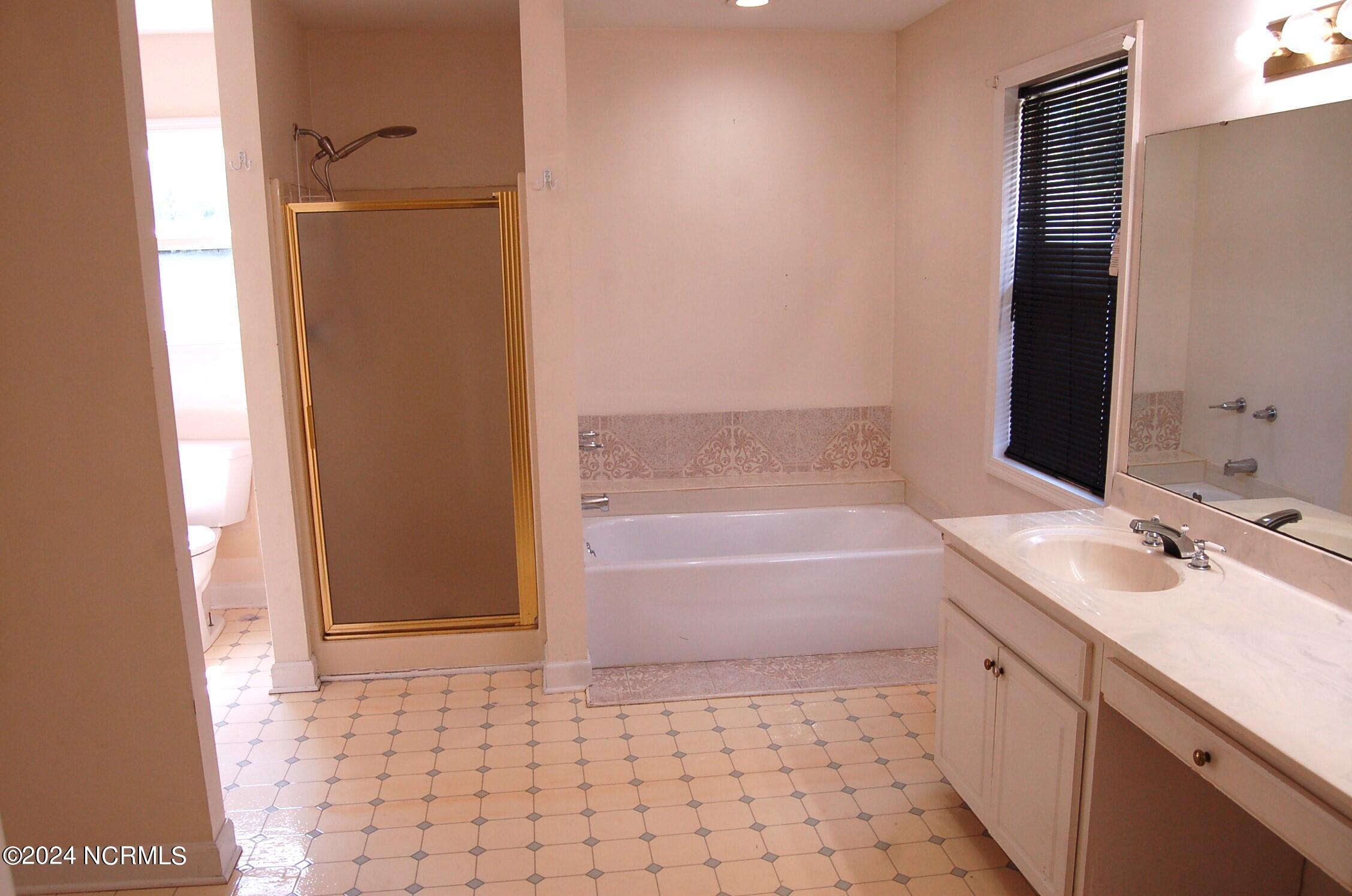 617 Lee Drive Havelock, NC 28532 - Photo 12 of 20 The master bath was a dream come true when it was added. It is very spacious and includes a walk-in closet, a second closet, double vanity, commode, soaking tub and walk-in shower.