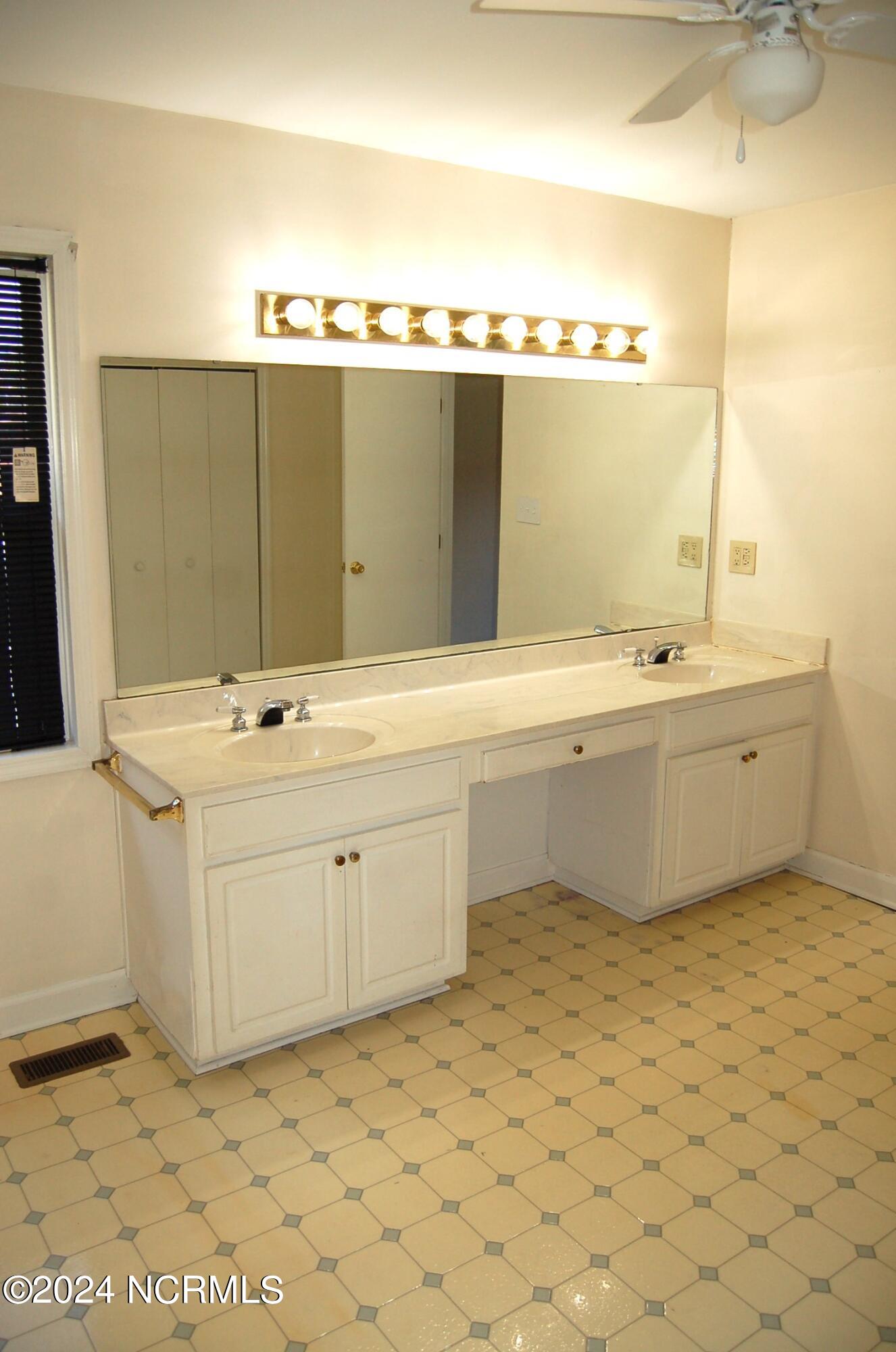 617 Lee Drive Havelock, NC 28532 - Photo 14 of 20 The dual vanity is extra wide allowing space for a stool or chair between the two sinks.