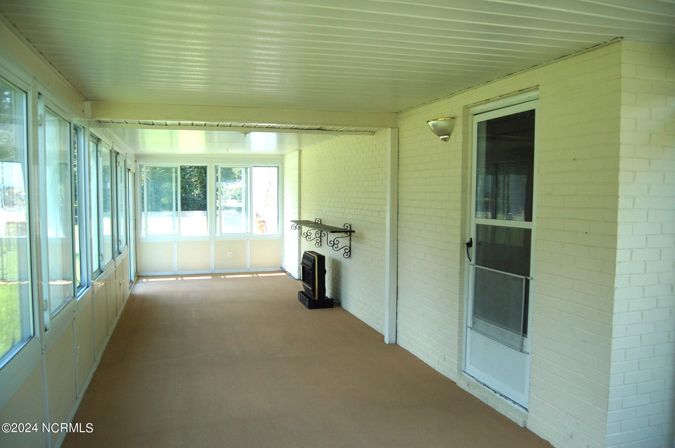 617 Lee Drive Havelock, NC 28532 - Photo 19 of 20 This very large space is so nice! All of the windows open by sliding easily to the side. There are 2 sets of sliding doors leading to either front or back yards.