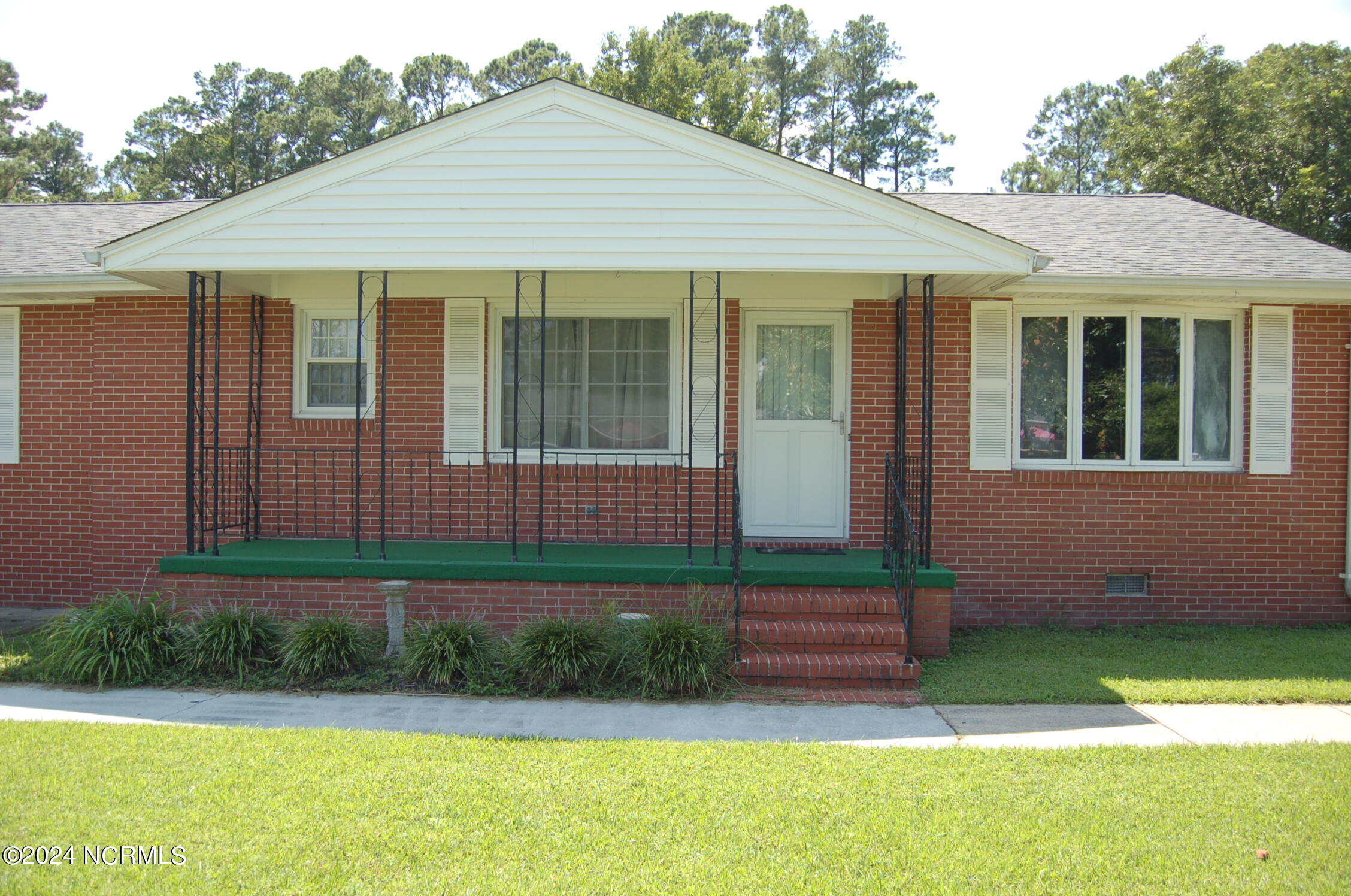 617 Lee Drive Havelock, NC 28532 - Photo 2 of 20 Spacious front porch overlooking the gorgeous front lawn.