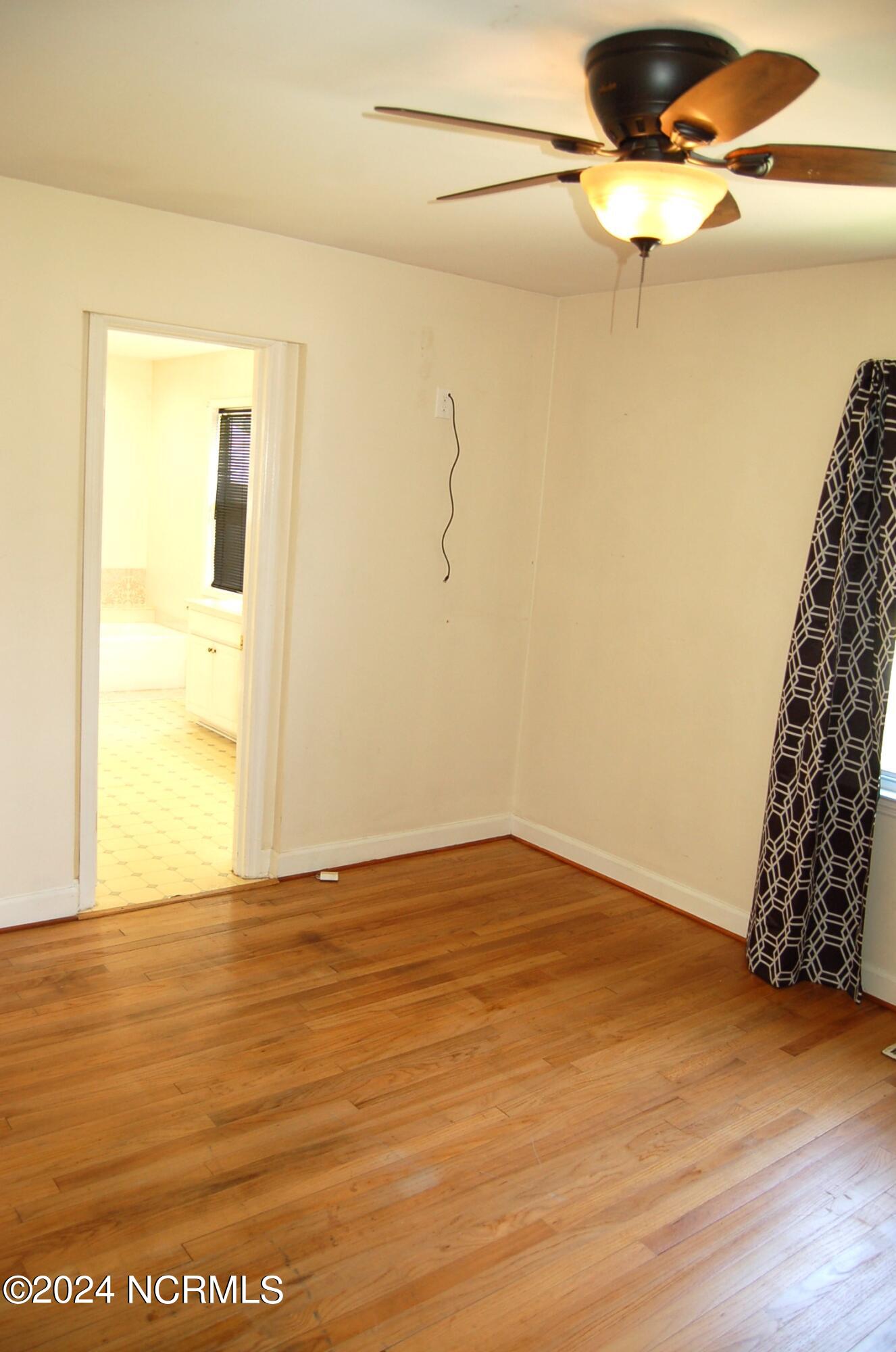 617 Lee Drive Havelock, NC 28532 - Photo 10 of 20 The master bedroom has a beautiful ceiling fan and gorgeous wood floors,