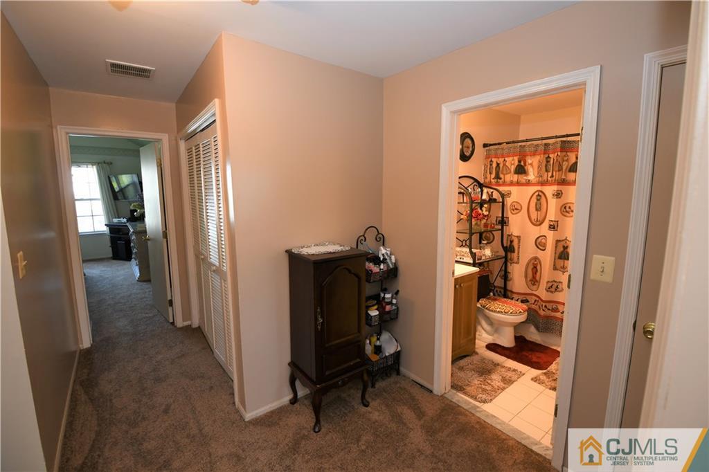 171 Salem Road North Brunswick, NJ 08902 - Photo 16 of 44 a view of a hallway with closet and a livingroom view
