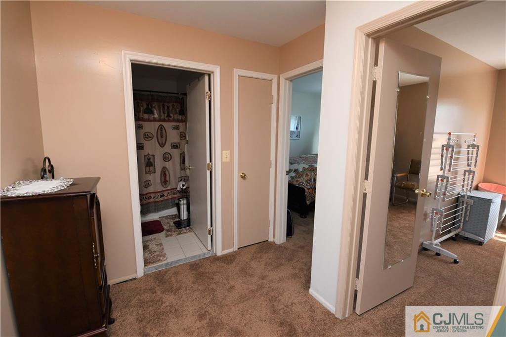 171 Salem Road North Brunswick, NJ 08902 - Photo 26 of 44 a view of a bathroom with a sink and closet