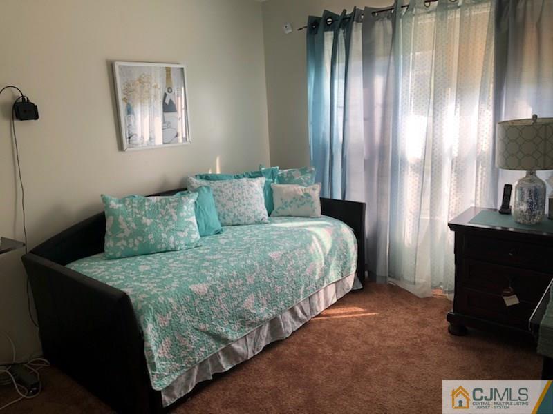 171 Salem Road North Brunswick, NJ 08902 - Photo 29 of 44 a bedroom with a bed and a painting on the wall