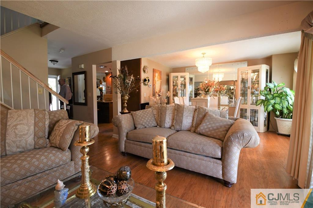 171 Salem Road North Brunswick, NJ 08902 - Photo 5 of 44 a living room with furniture and wooden floor