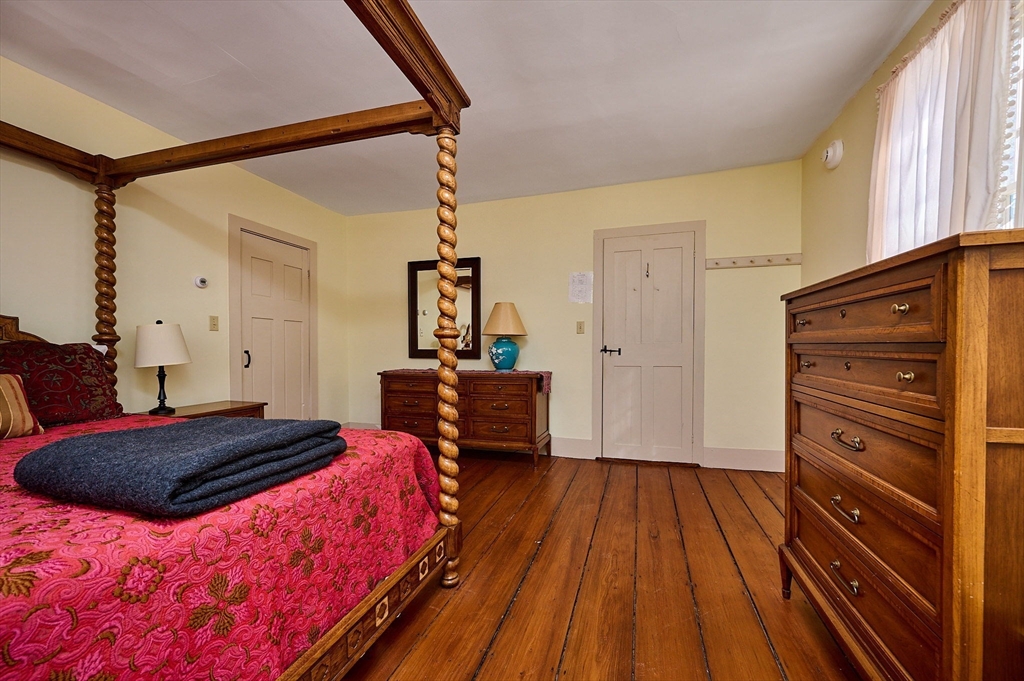 312 Zoar Road Rowe, MA 01367 - Photo 18 of 37 a bedroom with a bed and a dresser