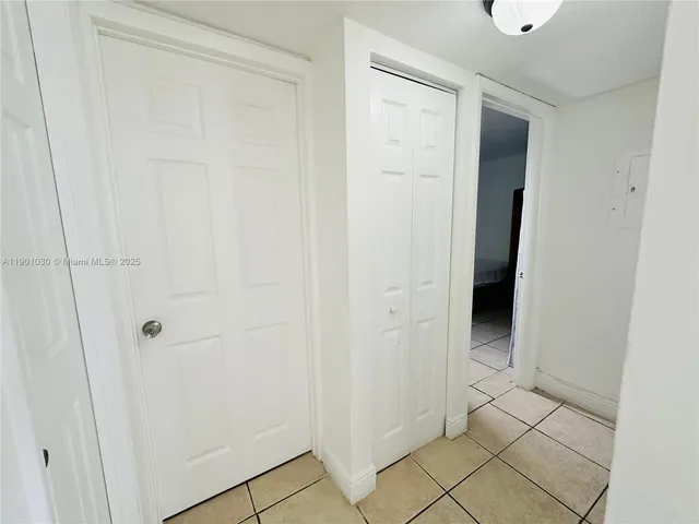 a view of a bathroom with white door