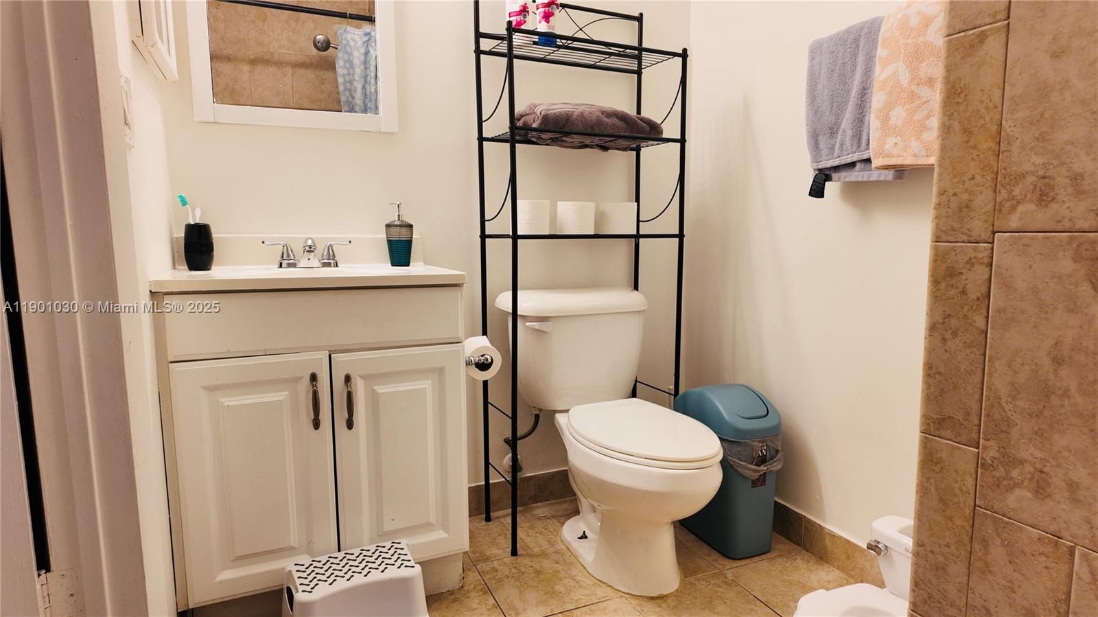 3037 Northwest 118th Drive, Unit 122D Coral Springs, FL 33065 - Photo 15 of 25 a bathroom with a toilet and a sink