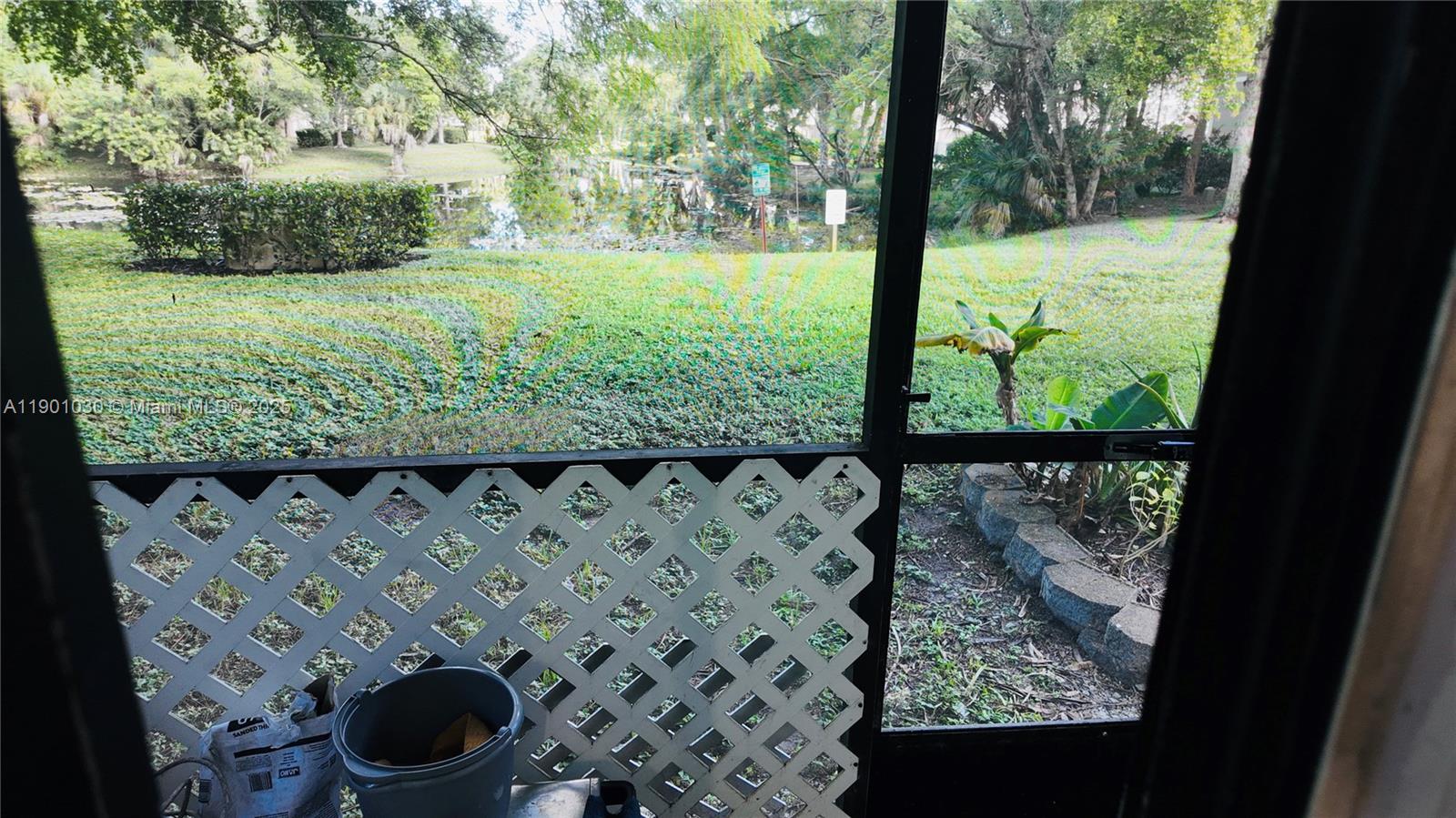 3037 Northwest 118th Drive, Unit 122D Coral Springs, FL 33065 - Photo 21 of 25 a view of a yard with wooden fence