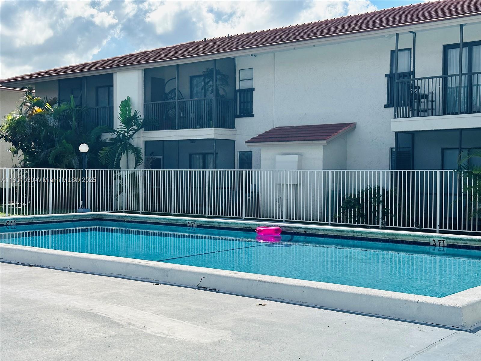 3037 Northwest 118th Drive, Unit 122D Coral Springs, FL 33065 - Photo 23 of 25 a backyard of a house