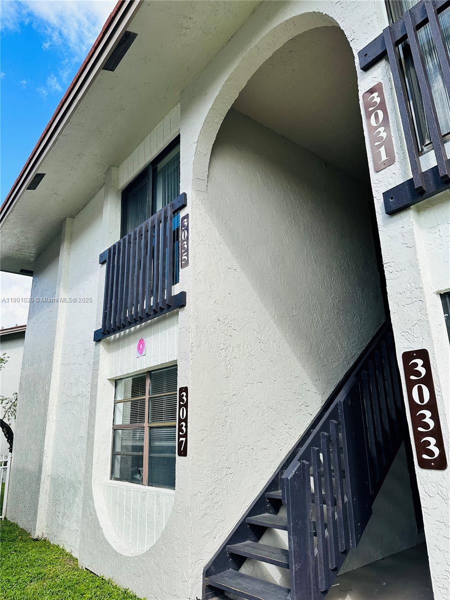3037 Northwest 118th Drive, Unit 122D Coral Springs, FL 33065 - Photo 24 of 25 a view of stairs
