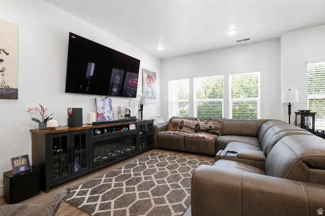 1213 West 1820th Street South Logan, UT 84321 - Photo 5 of 18 Living area with light wood-finish flooring and a corner window arrangement