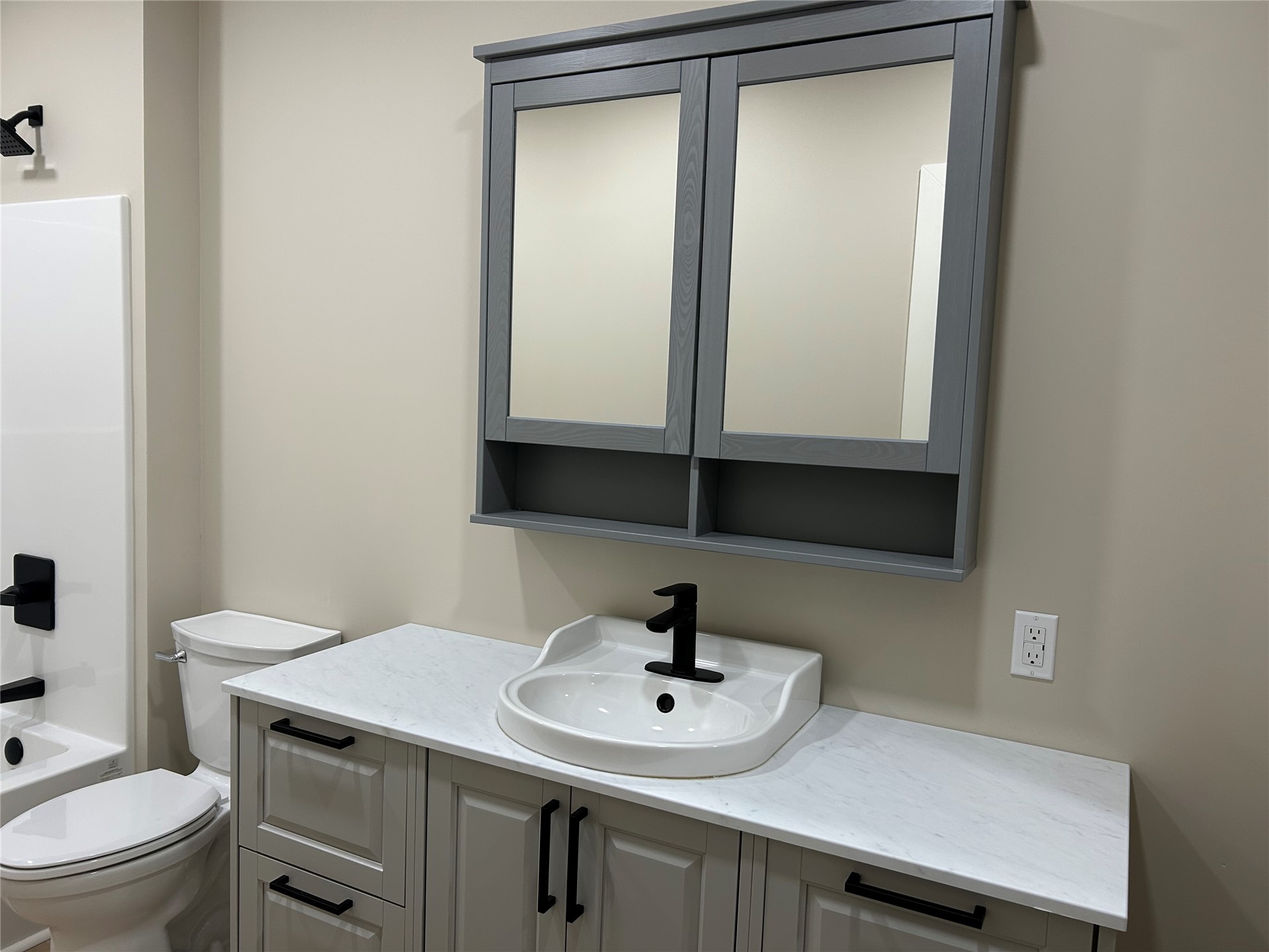 190 South 3 Mile Road Fort Gibson, OK 74434 - Photo 11 of 35 Vanity with light-toned cabinetry, white countertop, and integrated sink
